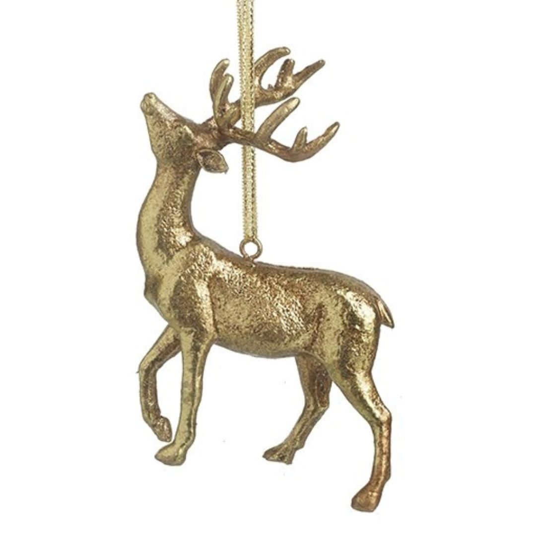 Gold deer ornament hanging on a white background