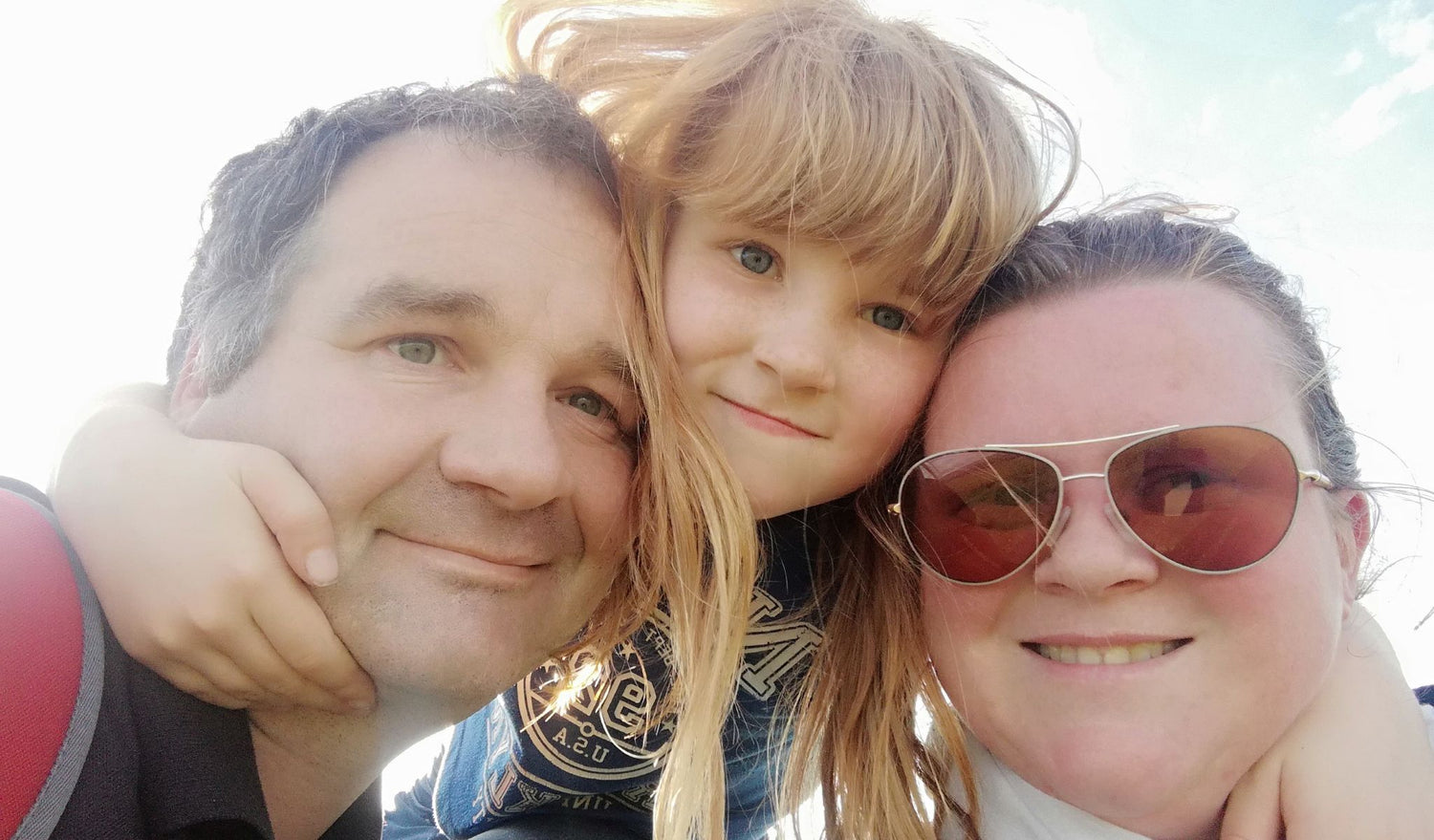 The Copper & Holly family outside after enjoying on a walk in the countryside