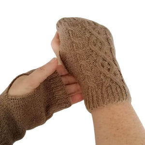 Showing the handwarmer/wristwarmer section of the 3 in 1 multi style biscuit brown gloves on the model's hands