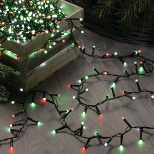 Image of the 520 glow worm lights being untangled from a box on the floor