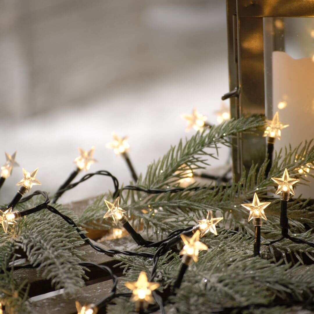 Close up of battery powered star lights on wooden sleigh