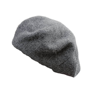 The charcoal grey beret hat a worn on a head