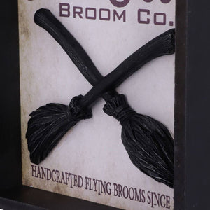 Showing a close up of the 3D brooms in the hocus pocus wooden sign