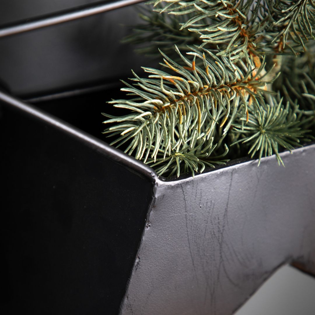 Close up of the base of the star metal planters (which has foliage in)