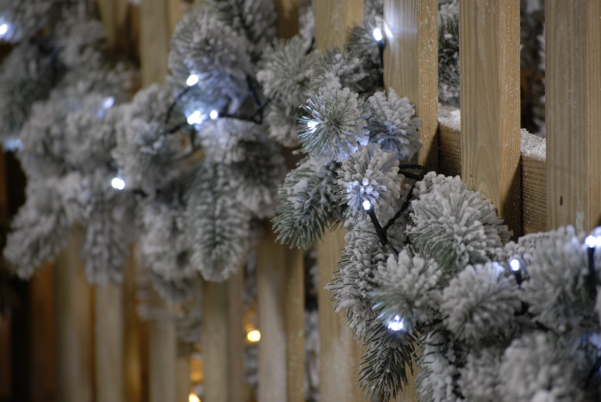 Close up of the 600 cold white LED string Christmas lights on a Christmas garland