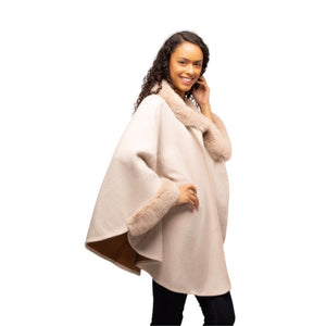 Cream faux fur Cape that is one size as worn on a model