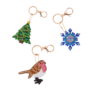 Crystal art kits of keyrings showing the three dsigns in this kit including Christmas tree, snowflake and robin