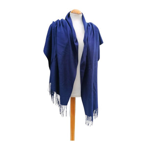 deep blue long pashmina scarf shawl with fringe draped over shoulders on a mannequin