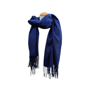 Deep blue long pashmina scarf shawl with fringe draped loosely around the neck on a mannequin