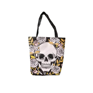 Day of the Dead tote bag showing the skull and roses pattern on the front, and black straps