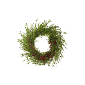 Rustic large decorated wreath with lots of green foliage, red berries around the bottom half of the wreath and small fir cones interspersed throughout the wreath