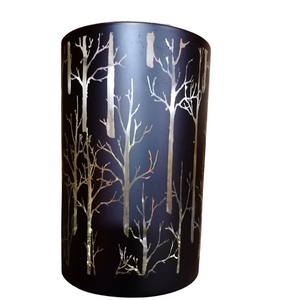 Large black and gold Christmas candle holder with trees etched outof the black paintwork.  When candle is lit it shines through.