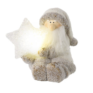 Sitting down light up Father Christmas holding a little star in his hand