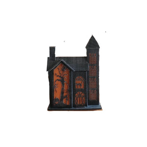 Lighted haunted house decoration in the dark without the lights on