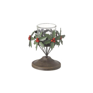 Showing the metal holly tea light holder on a pedestal with a ring of metal holly and berry clusters sitting around a glass tea light beaker