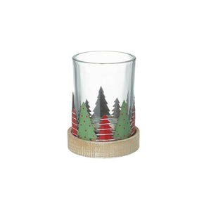 Metal tree Christmas candle holder with red trees and white stripes and green trees with red dots around the rim of the Christmas candle holder