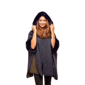 Navy blue faux fur cape with hood as worn on a model