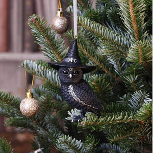 Showing the black owl in hat on a Christmas tree