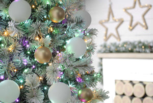 This photo shows the 520 pastel tree lights on a decorated flocked Christmas tree