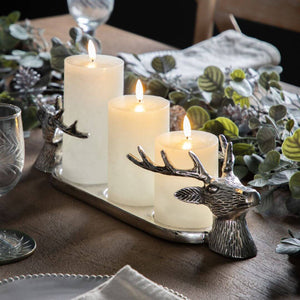 Showing the full length stag head candle holder with 32 pillar candles in