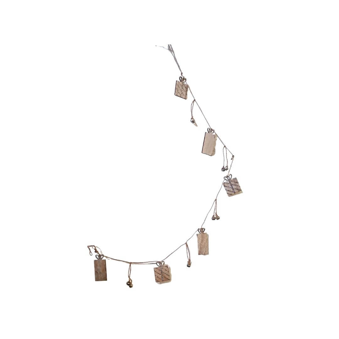 Showing the wooden presents with the silver detailing and the silver sleigh bells pair in between the presents.  The garland is tied on via brown string